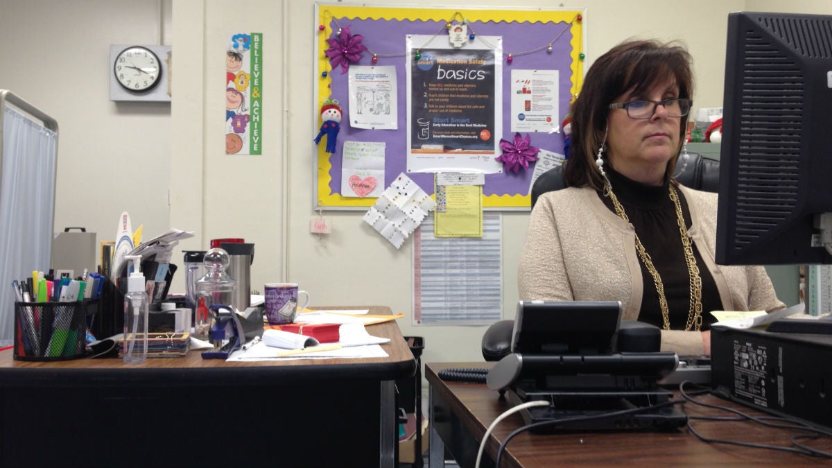 Fran Avena (above) works from her office at Warner Elementary School. The posters behind her come from the Smart Moves