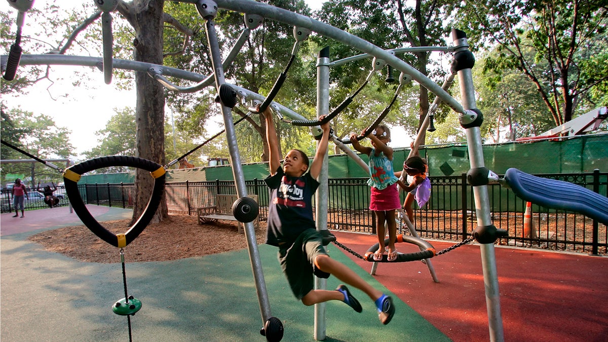  Children play on playground equipment at Franklin Square in Philadelphia, Pa. Our partners over at PlanPhilly are celebrating what would have been Jane Jacobs' 100th birthday this weekend with Jane's Walk 2016. (AP File Photo/George Widman) 