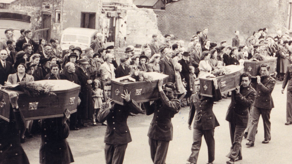  In a funeral procession, men carry the caskets of children killed when an American aircraft crashed in Freckleton, England, in 1944. (Image courtesy of James Hedtke.) 