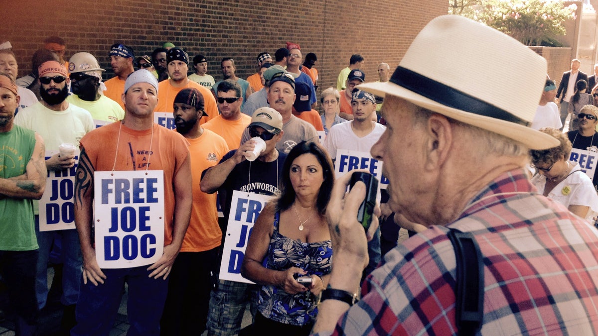  Labor activist Jim Moran addresses supporters of Joseph Dougherty outside the federal courthouse in Philadelphia. (Dave Davies/WHYY) 