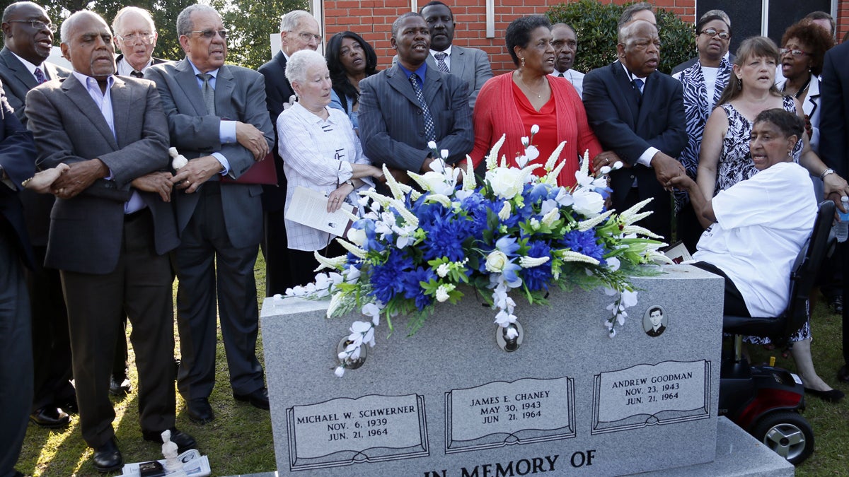  Civil rights activists, from left, Bob Moses, Dave Dennis, Rita Schwerner Bender, Leroy Clemons, Myrlie Evers-Williams and U.S. Rep. John Lewis, D-Ga., gather outside Mt. Zion United Methodist Church in Philadelphia, Miss., Sunday, June 15, 2014, and sing 