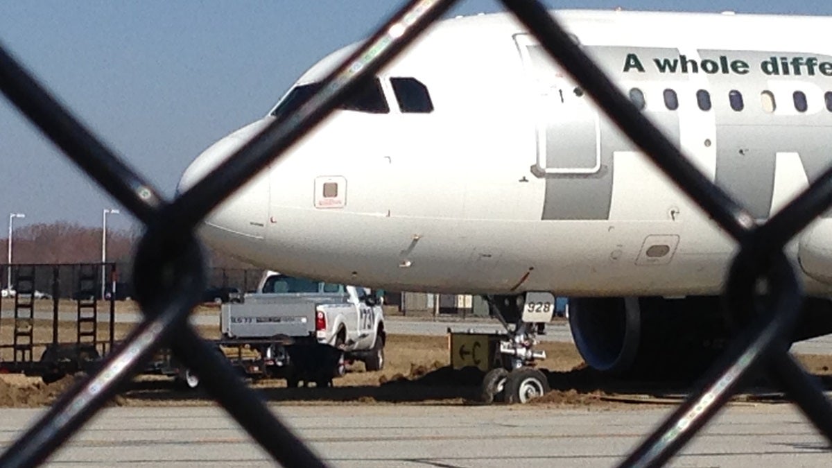  The front wheels of this Frontier plane got stuck in the mud Sunday night. (John Jankowsi/for NewsWorks) 