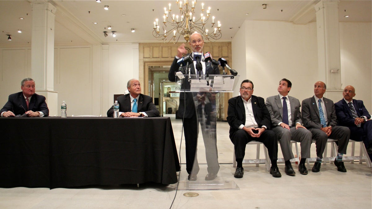 Pennsylvania Gov. Tom Wolf announces a $10 million state redevelopment grant for the Gallery mall in Center City. Wolf is flanked by state and local elected officials and Joe Coradino (second from left) chief executive of Pennsylvania Real Estate Inventment Trust (PREIT) which owns the mall. (Emma Lee/WHYY)
