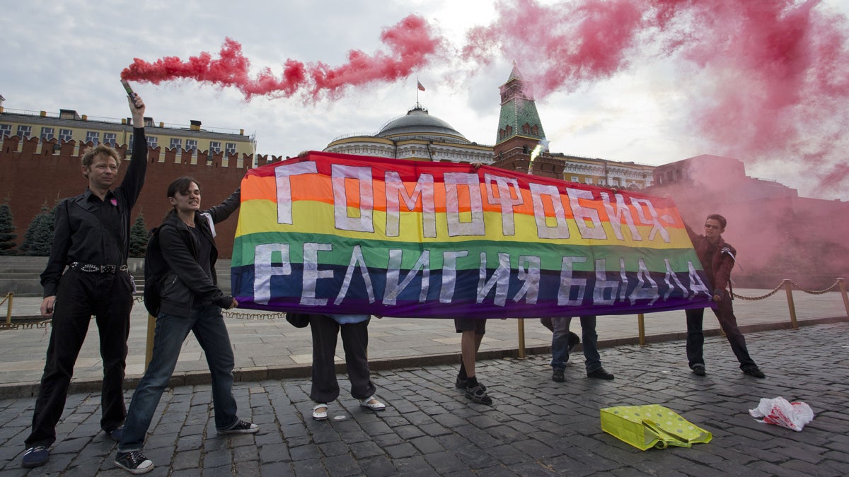  Gay rights activists hold a banner reading 
