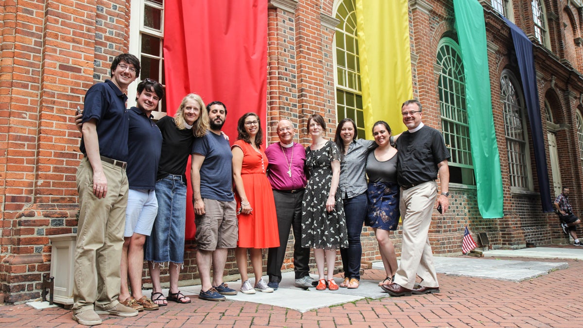  Members of the Christ Church community pose with Bishop Gene Robinson before an interfaith ceremony in July. The author stands at the far left. (Kimberly Paynter/WHYY, file) 