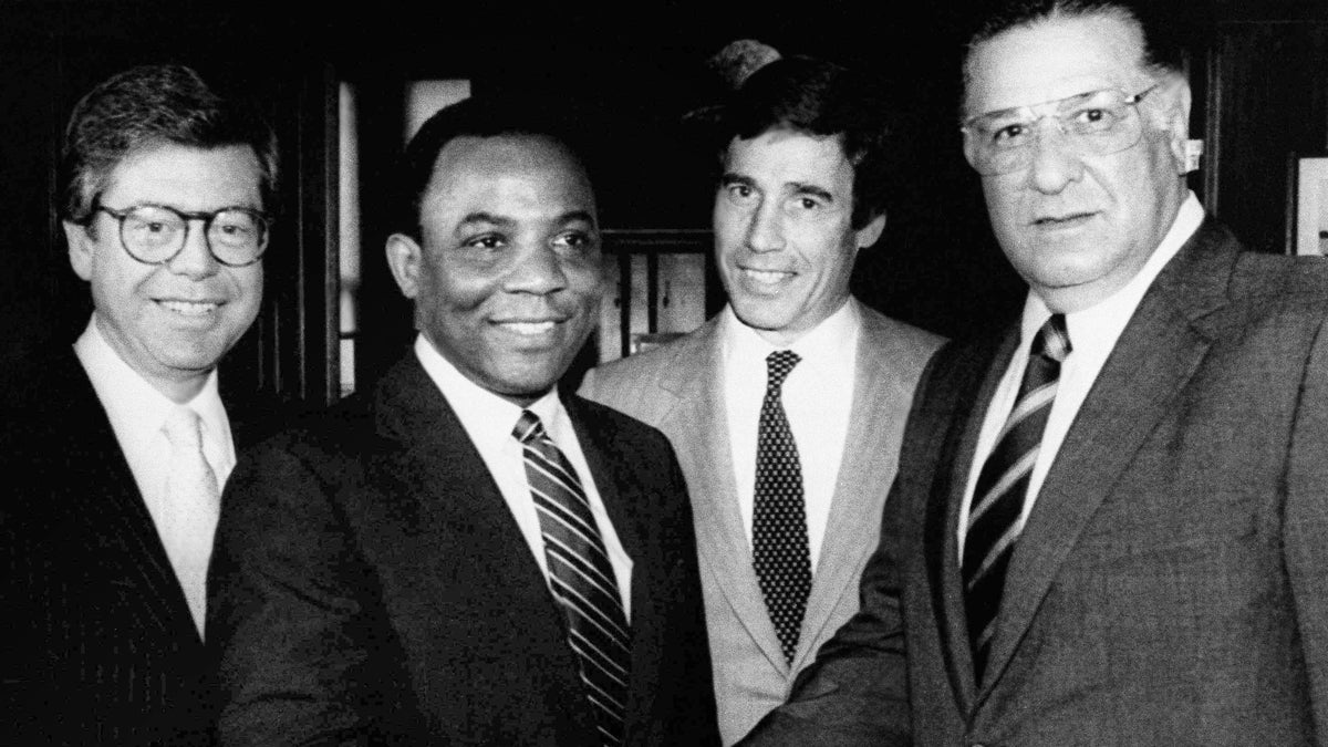  W. Wilson Goode and Frank Rizzo (foreground) are shown shaking hands in the midst of Philadelphia's 1983 Democratic mayoral primary race. After losing, Rizzo put his support behind Goode, a move that Republican mayoral candidate John Egan said led to a lucrative position for Rizzo at Philadelphia Gas Works. (AP Photo/Cliff Hence, file) 