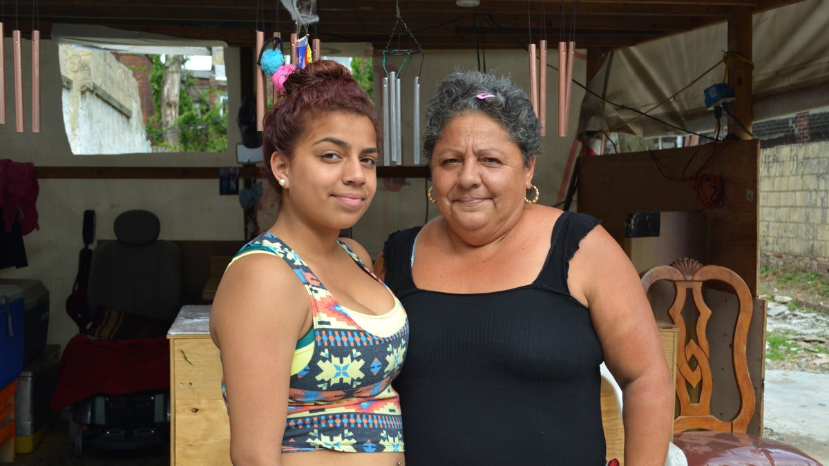 Grisel Pellot, 14, a recent graduate of De Burgos Elementary, with her grandmother, Aurora Sepulveda. (Kevin McCorry/WHYY)