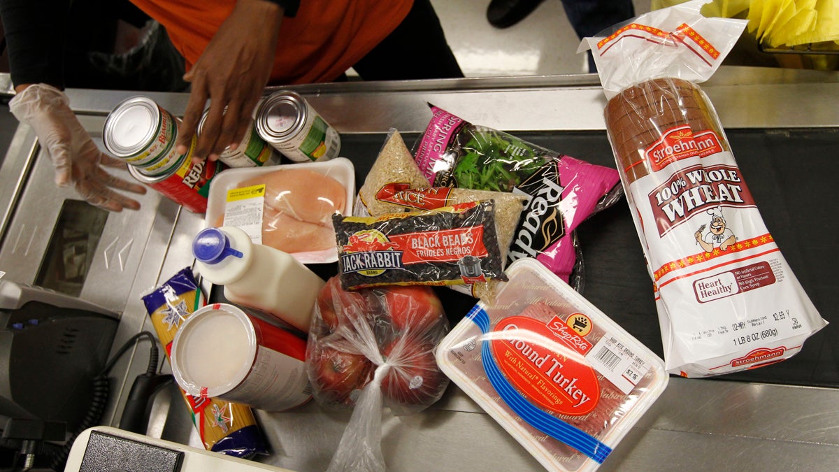  A cashier scans purchases at a ShopRite grocery story in Philadelphia. (Matt Rourke/AP) 