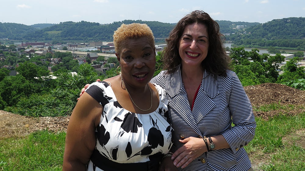  Ronell Guy and Councilwoman Deb Gross in the Northside neighborhood in Pittsburgh, where many properties are abandoned and blighted.  