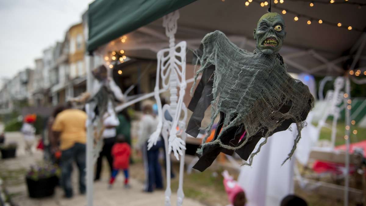 A ghastly ghoul hangs at the Halloween festivities organized for West Rockland Street in Germantown by Emaleigh and Aine Doley on Halloween evening. (Tracie Van Auken/for NewsWorks)