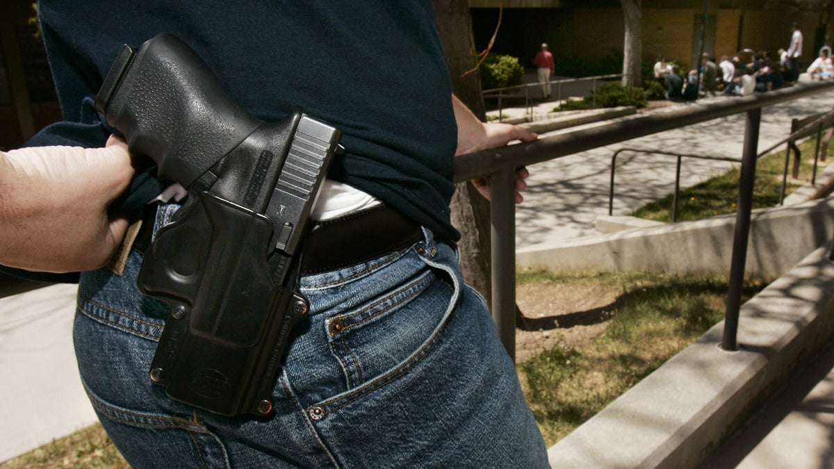  A man displays his handgun. (AP Photo/Douglas C. Pizac, file) 