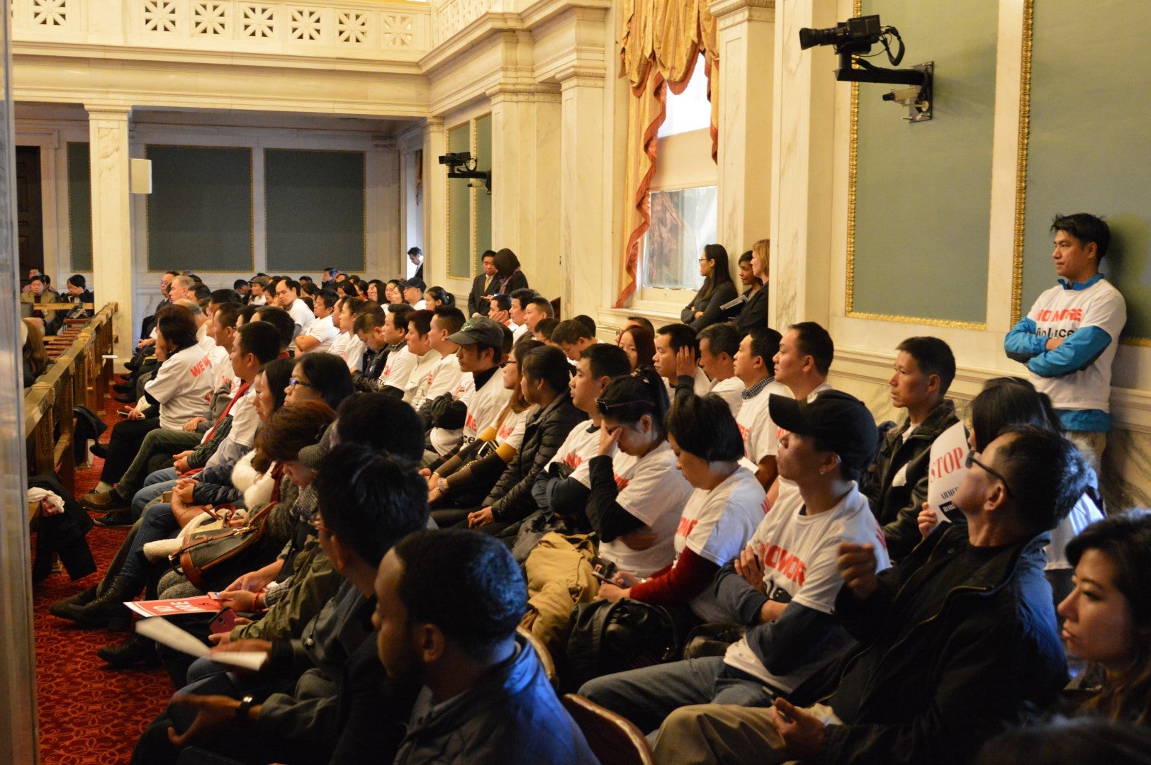 Members of Philadelphia's Asian community attended a hearing on home invasion robberies. (Tom MacDonald/WHYY)