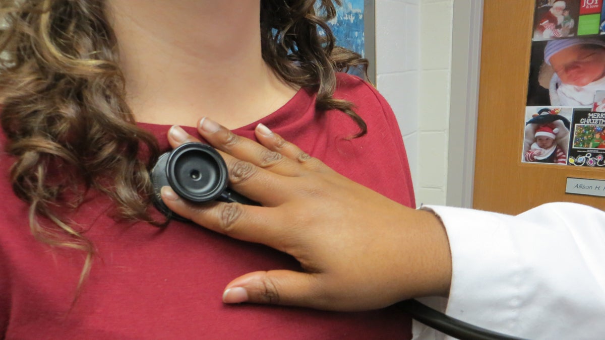 Proper stethoscope placement is crucial to perceiving abnormal heart sounds. Students first learn to listen to four main valves. (Taunya English/for WHYY)