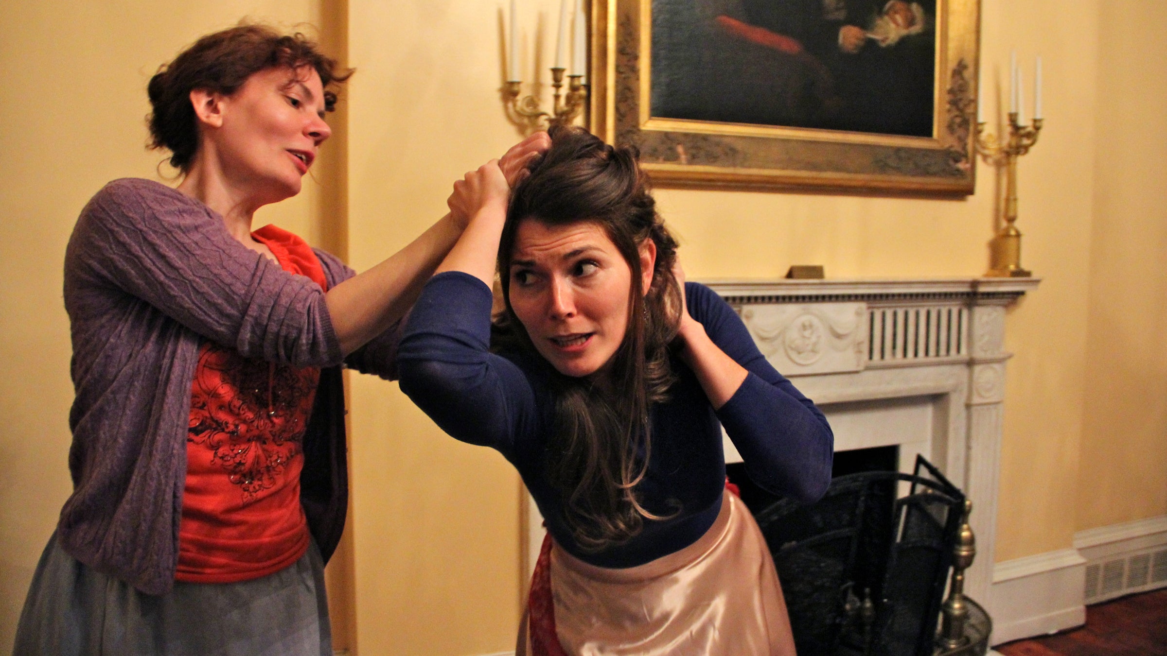  Jennifer Summerfield (left), as Hedda, and Jessica DalCanton as Thea rehearse a fight scene from Hedda Gabler in the historic Physick House in Philadelphia. (Emma Lee/WHYY) 