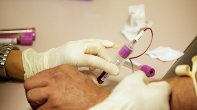  A Philadelphia resident living with Hepatitis C checks in for a blood screening and medication pickup. (Nathaniel Hamilton/for NewsWorks) 