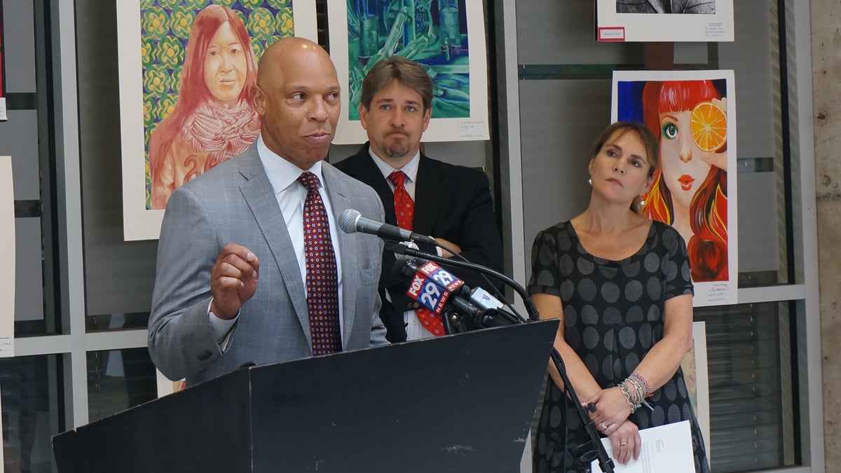  From left, Philadelphia  Schools Superintendent William Hite; David Rubin, the founding co-director of PolicyLab at The Children's Hospital of Philadelphia; and city Department of Human Services Commissioner Anne Marie Ambrose gather to announce a new report on the educational outcomes of public school students involved with DHS. (Jessica McDonald/WHYY) 