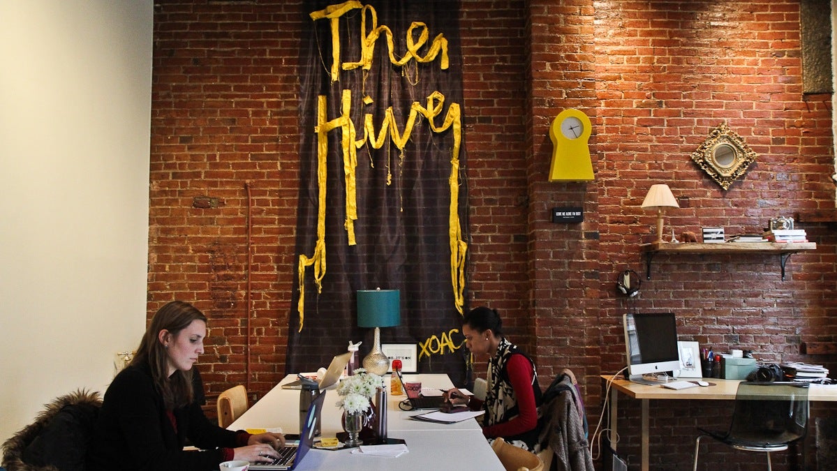Mary Thinbault, Public Relations Strategist and Caroline Davis, former sales representative, work together at The Hive, a co-working space for women. (Kimberly Paynter/WHYY)