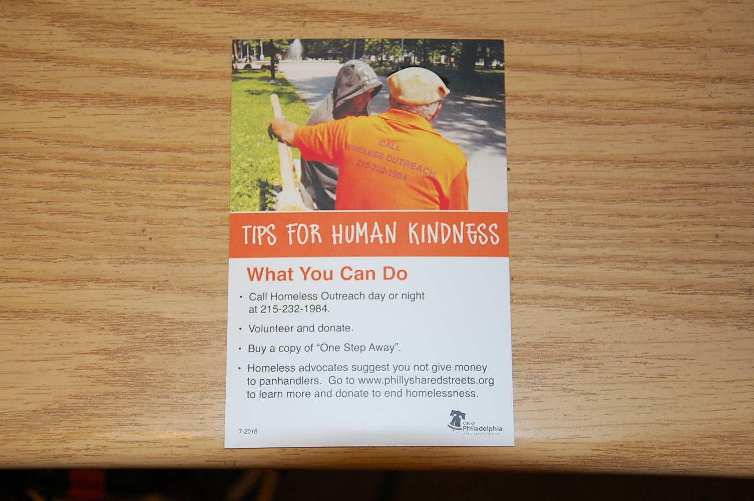 The city will hand out cards with alternatives for helping homeless. (Tom MacDonald/WHYY)