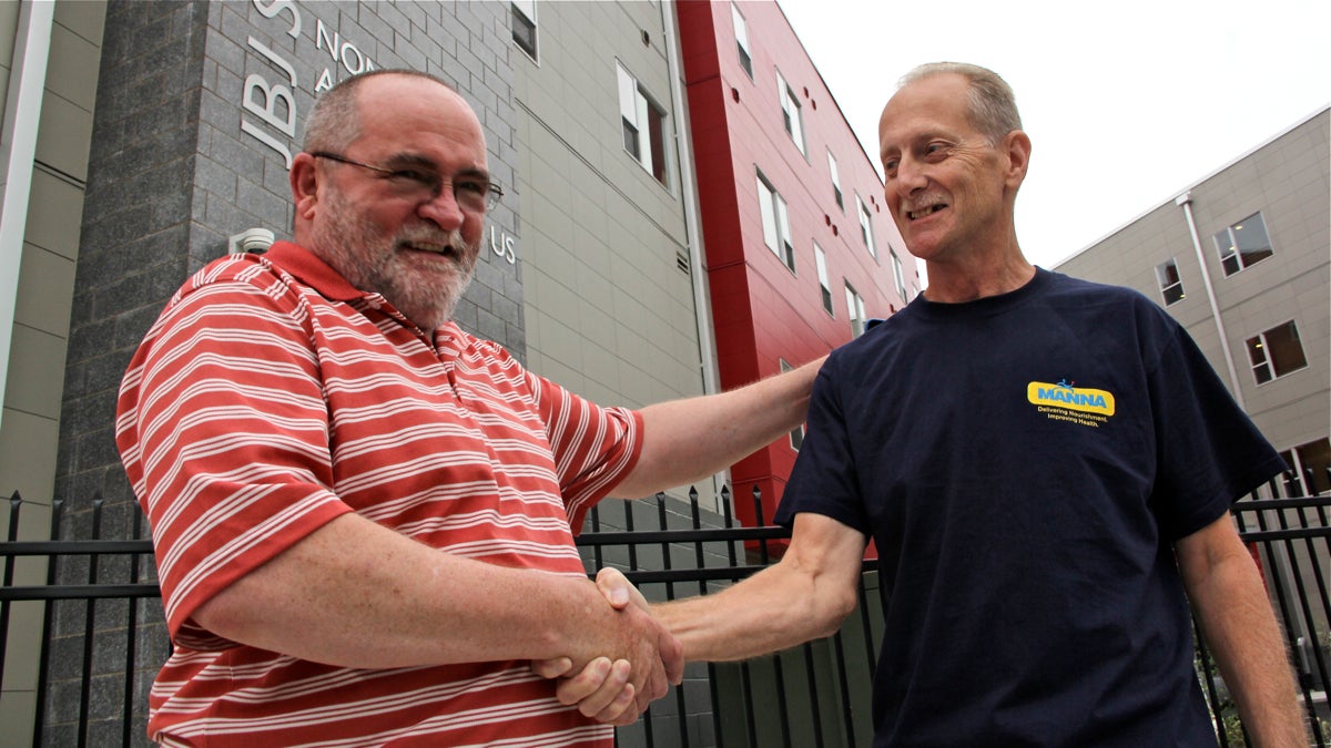  Bob Long (right) shakes hands with Earl Driscoll, the social worker who helped him find his way home. (Emma Lee/for NewsWorks)  