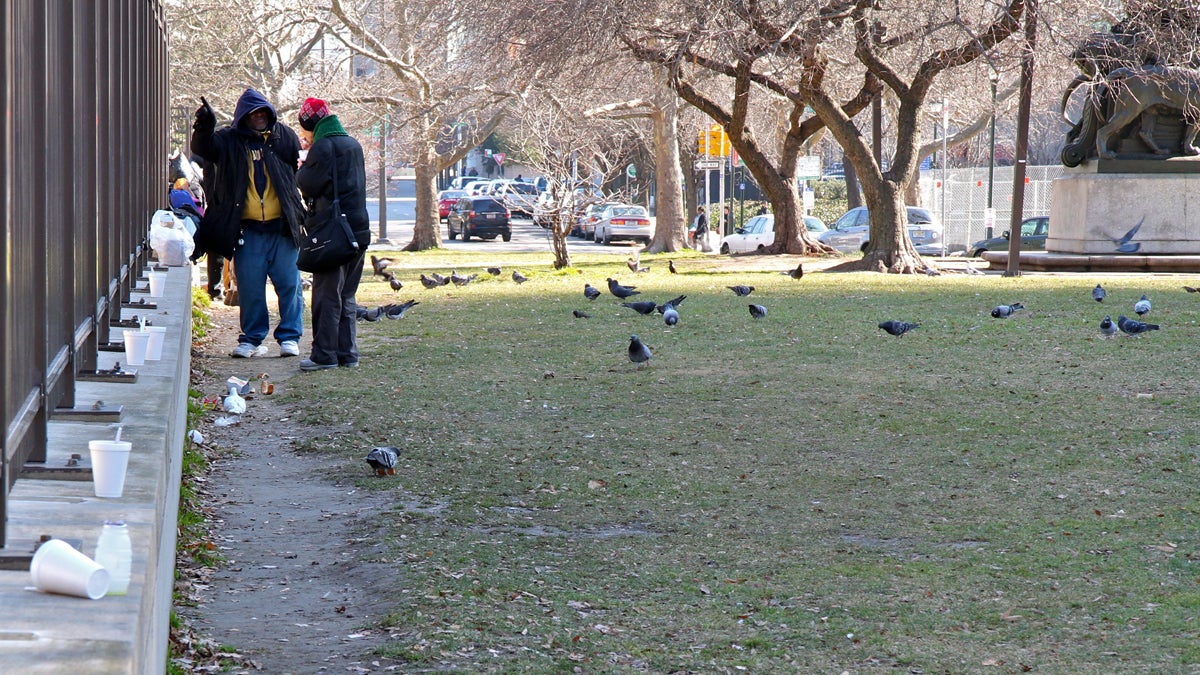  A row of empty styrofoam cups remain in a park near the Free Library where servings of chili were doled out to homeless people. (Emma Lee/WHYY, file) 