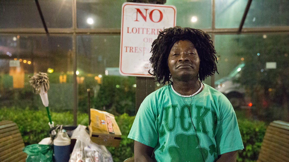  Nathaniel Blue takes shelter at a bus stop in Harrisburg, Pa. on a rainy Saturday night. (Lindsay Lazarski/WHYY)  