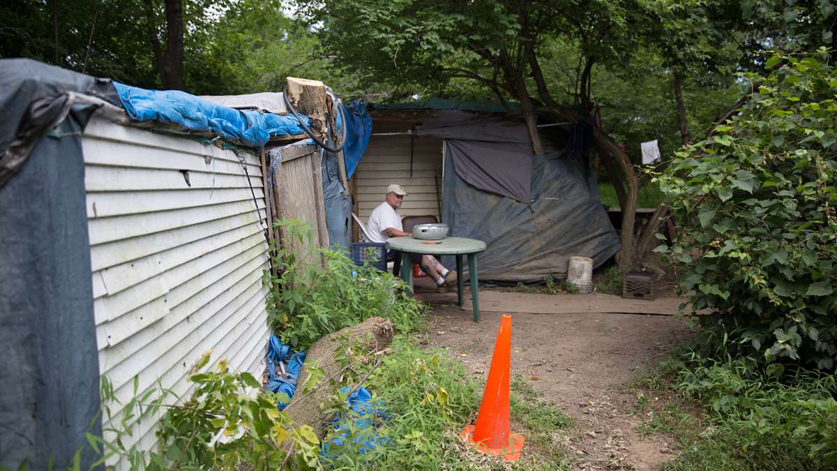 Dave Ritchie, a plumber by trade, lives in a nearby self-made shack in the woods in Allentown, Pa. (Lindsay Lazarski/WHYY) 