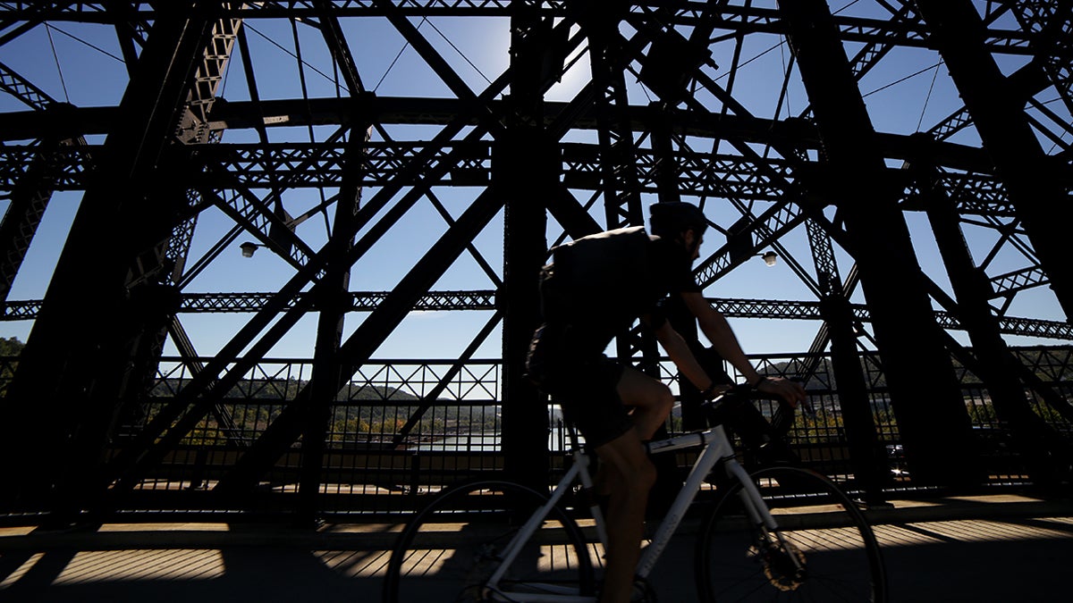  A bicyclist crosses the Hot Metal Bridge on a late fall day.  (Ryan Loew for 90.5 WESA) 