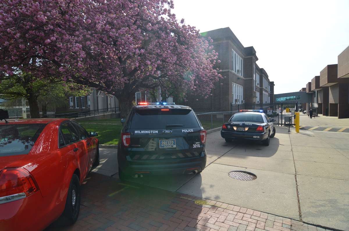 Police vehicles outside Howard High in Wilmington. (John Jankowski/for NewsWorks)