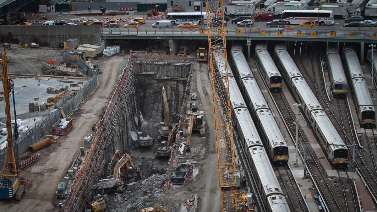  This April 2014 photo shows ongoing construction of a rail tunnel, left, at the Hudson Yards redevelopment site on Manhattan's west side in New York.  Amtrak is constructing an 800-foot-long concrete box inside the project to preserve space for a tunnel from Newark to New York City that would allow it to double rail capacity across the Hudson River. (AP Photo/Bebeto Matthews) 