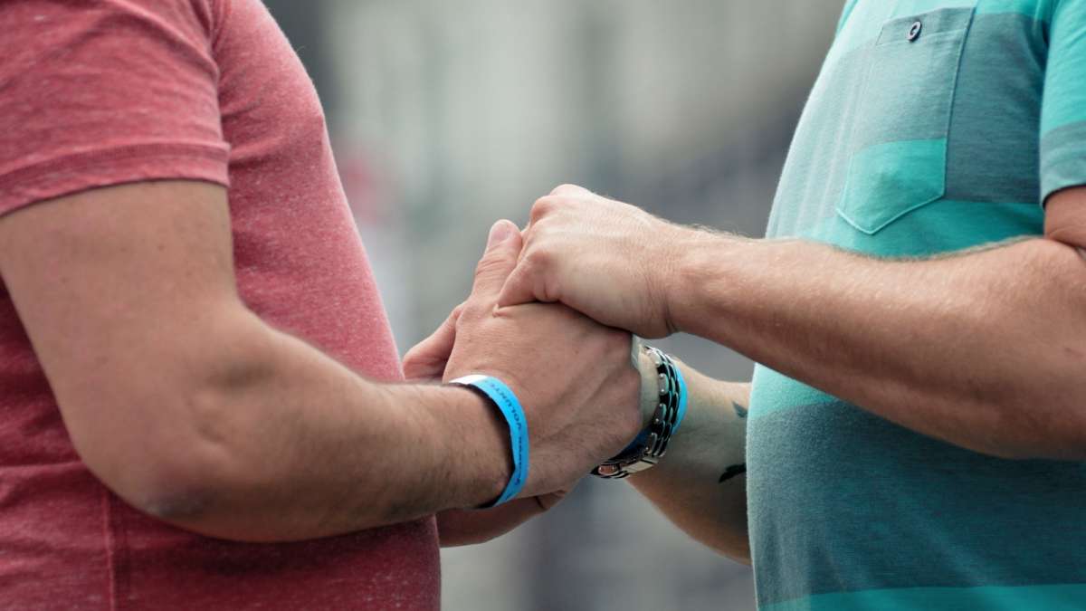  Biff Viner and Thomas Krik of Philadelphia hold hands as they say their vows. (Bas Slabbers/for NewsWorks) 
