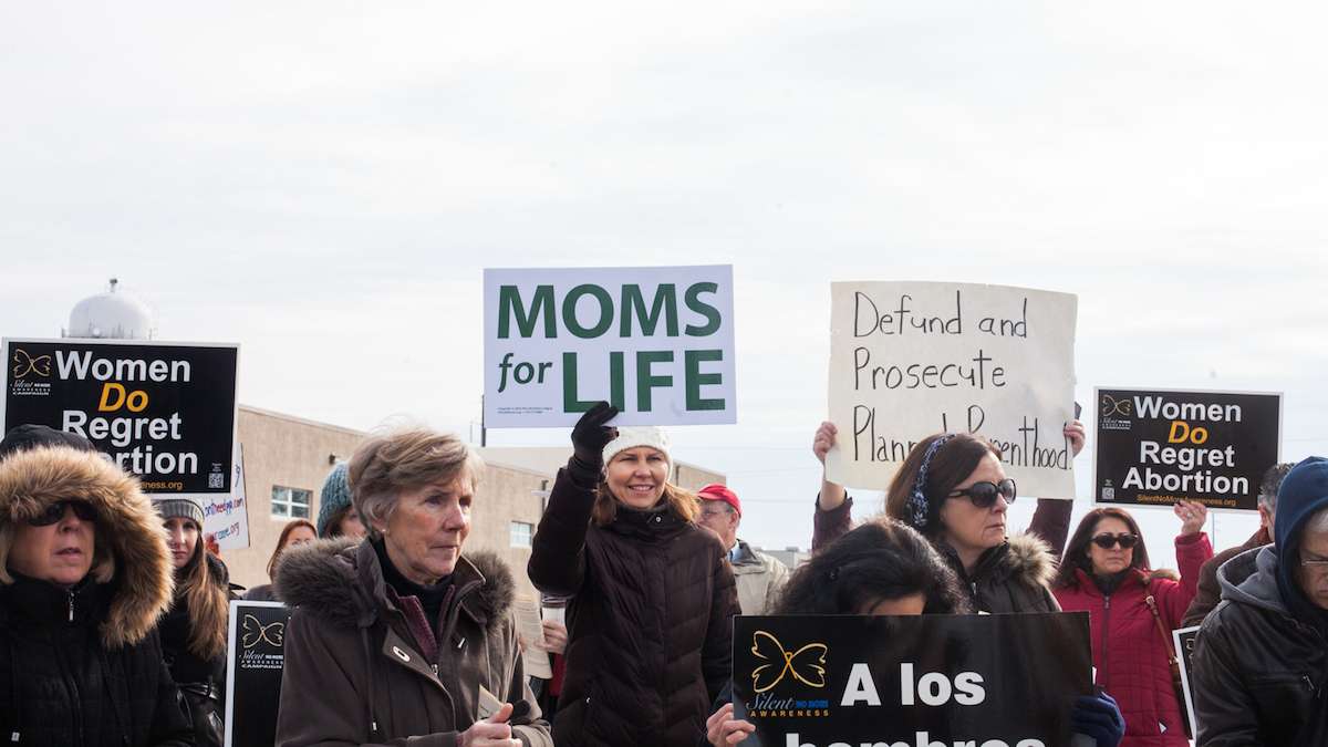 Pro-life protesters gather outside of Planned Parenthood on Saturday morning in Warminster, Pa., to support a proposal to defund the organization. (Brad Larrison for WHYY)
