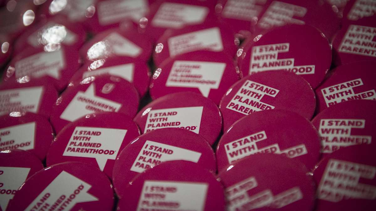 Pins on display at Philadelphia Episcopal Cathedral at a Planned Parenthood event. (Branden Eastwood for WHYY)