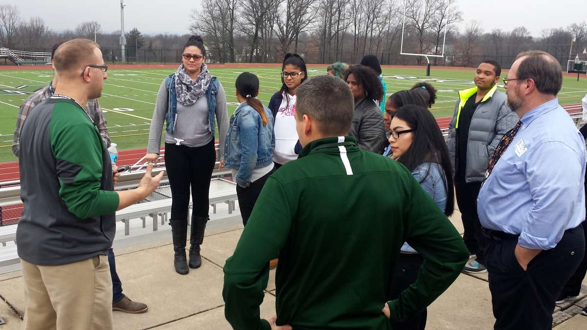 A. J. Maida leads students from Kensington Health Sciences Academy on a tour of the Methacton High School athletic facilities.