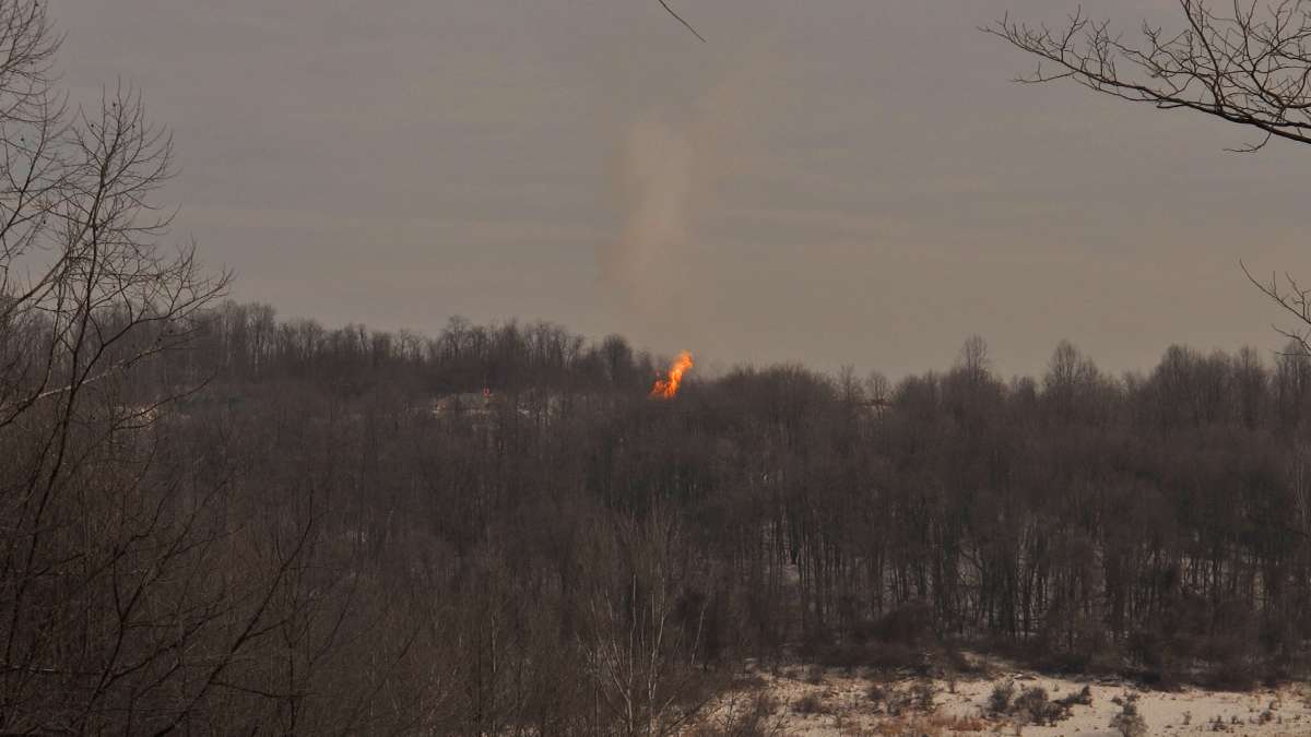  The well fire in Greene County, Pennsylvania, as seen from the top of a hill. (Katie Colaneri/WHYY) 