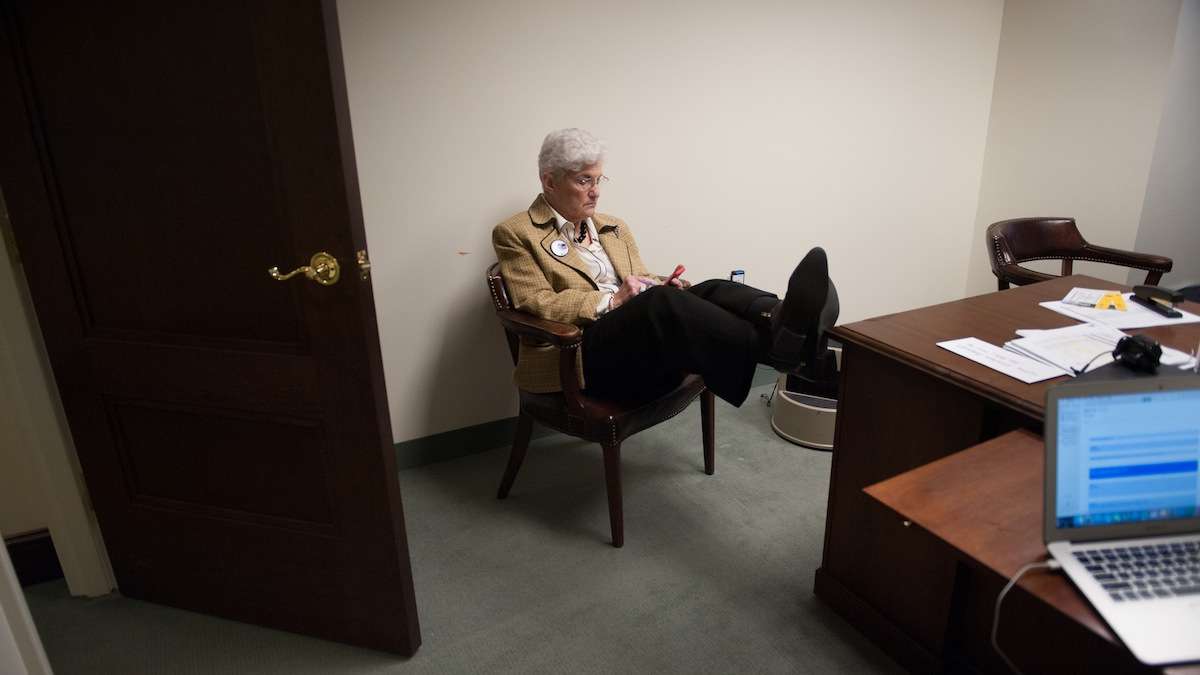  Lynne Abraham checks her phone during a break in a busy campaign Wednesday. (Tracie Van Auken/for NewsWorks) 