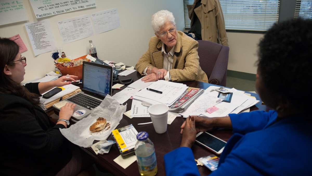  Lynne Abraham chats with staffers in her Center City campaign headquarters last week. (Tracie Van Auken/for NewsWorks) 