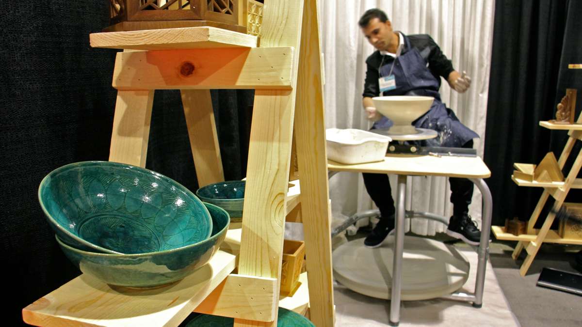 Abdul Matin Malikzadah throws bowls on his potters wheel at the Contemporary Craft Show