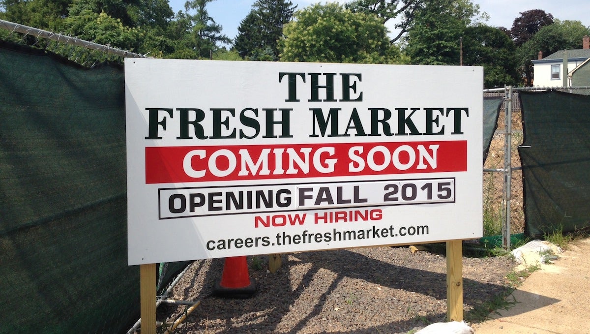  A sign at 8200 Germantown Ave. indicates the Fresh Market will open in fall 2015. (Neema Roshania/WHYY) 