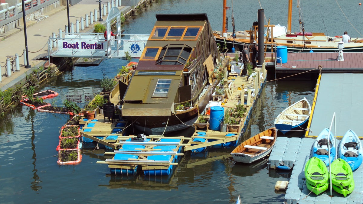  Mary Mattingly's 'WetLand' looks like a rowhouse sinking into the Delaware, surrounded by floating gardens. (Elisabeth Perez-Luna/WHYY) 