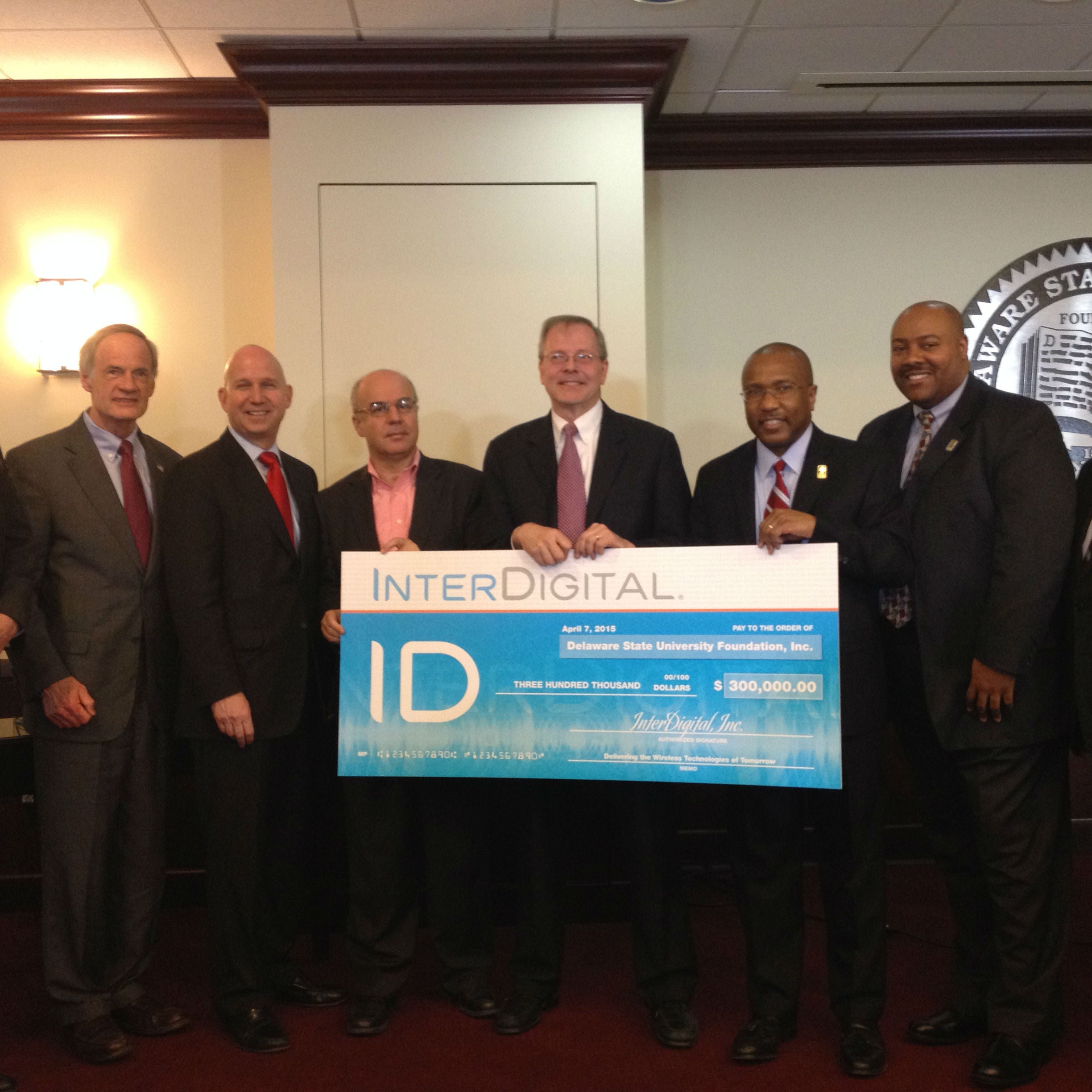  (From left) Senator Tom Carper, Governor Jack Markell, Dean Noureddine Melikechi, InterDigital CEO William Merritt, President Harry Williams, and Board Chair David Turner at Tuesday's announcement. (Avi Wolfman-Arent / Newsworks) 