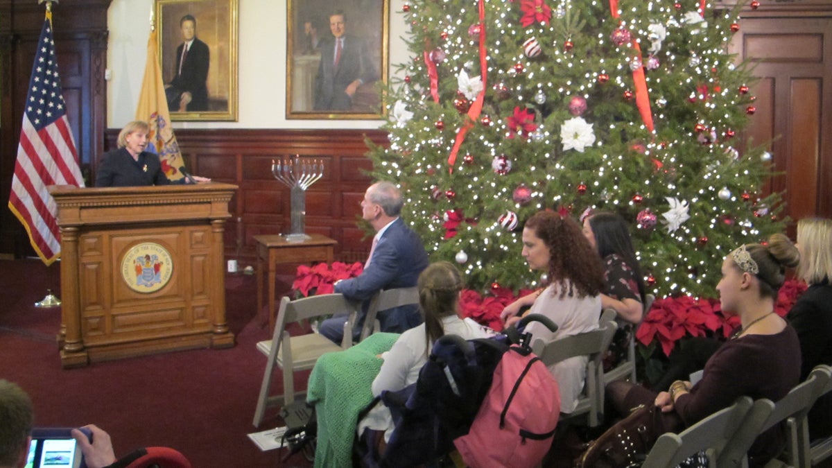 New Jersey Lt. Gov. Kim Guadagno meets with Catastrophic Illness in Children Relief Fund program participants at the Statehouse in Trenton. (Phil Gregory/WHYY)