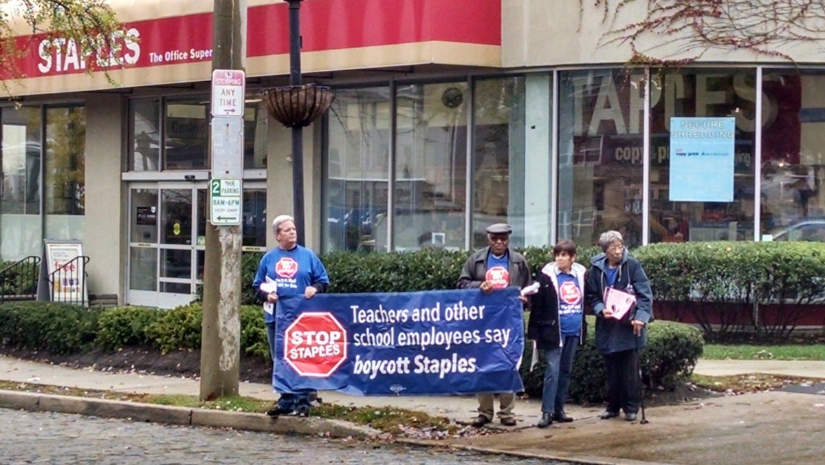  Members and supporters of the American Postal Workers Union marched outside the Germantown Avenue Staples on Thursday afternoon. (Dan Pasquarello/for NewsWorks) 