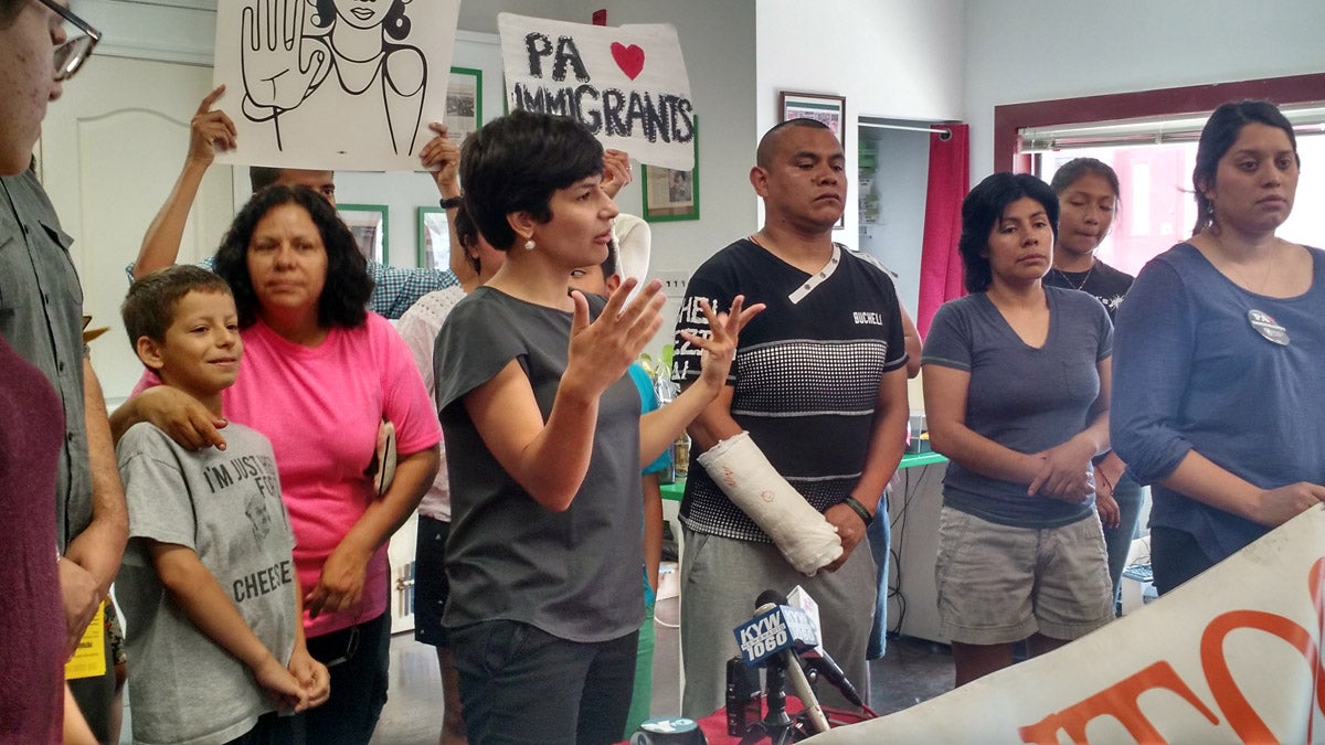 Immigrant advocates gather in South Philadelphia to decry a tie Supreme Court decision