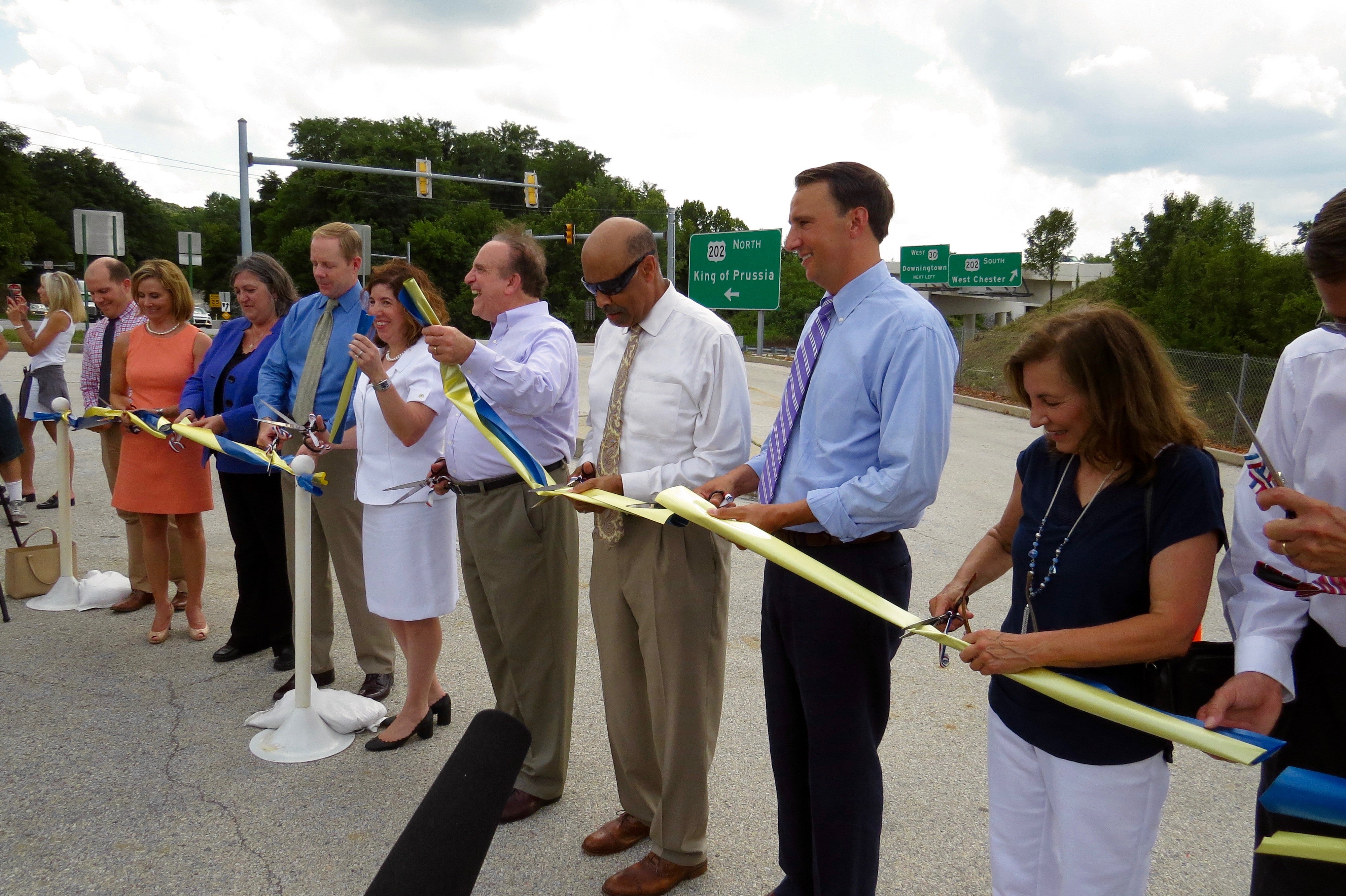 Chester County and state officials celebrate the newly-widened U.S. Route 202 with a ceremonial ribbon cutting. (Rob Zawatski)