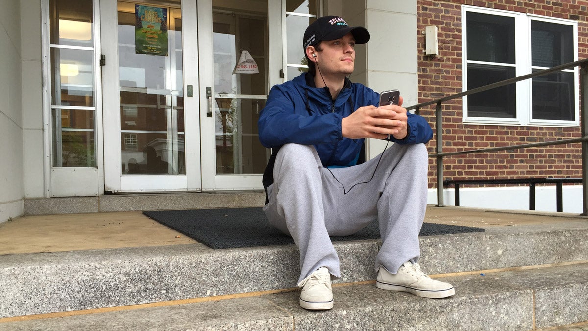 Sean Ryan sits on the stoop of his University of Delaware dorm