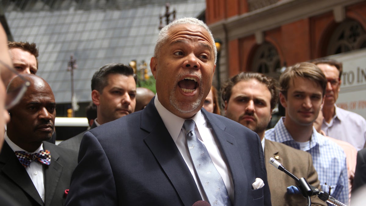  Anthony Hardy Williams held a feisty press conference outside a Locust Street restaurant amid confusion about a poll being released inside the eatery on Friday. (Emma Lee/WHYY) 