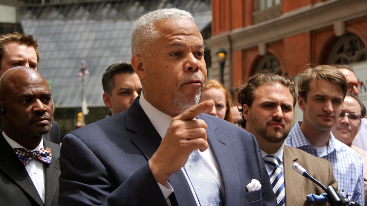  Mayoral candidate Anthony Hardy Williams had some choice words about the perceived front runner during Friday afternoon's press conference near Broad and Locust sts. (Emma Lee/WHYY) 