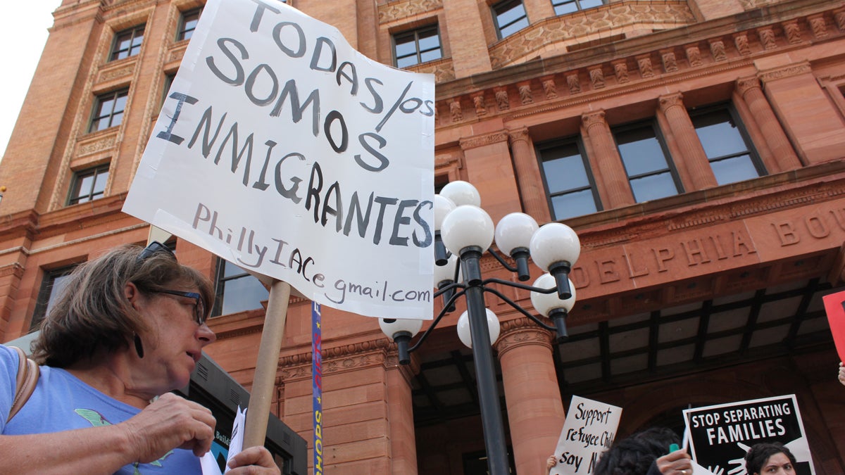  A small group of Tea Party protesters were met by a large rally of immigrant advocates outside the Mexican consulate on Friday in Philadelphia. (Emma Jacobs/WHYY) 