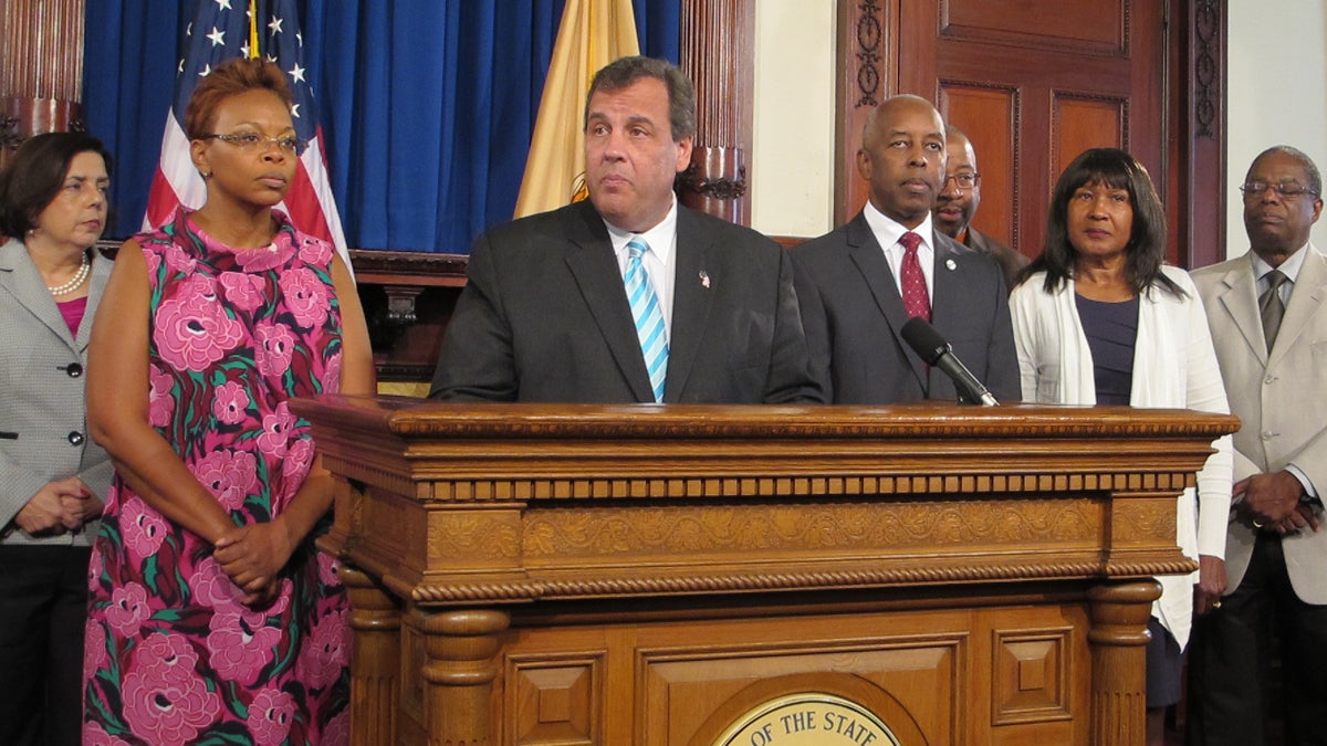  Flanked by Camden Mayor Dana Redd, left, and Trenton Mayor Eric Jackson, Gov. Chris Christie Wednesday makes a pitch for changes to New Jersey's bail system. (Phil Gregory/ WHYY)   