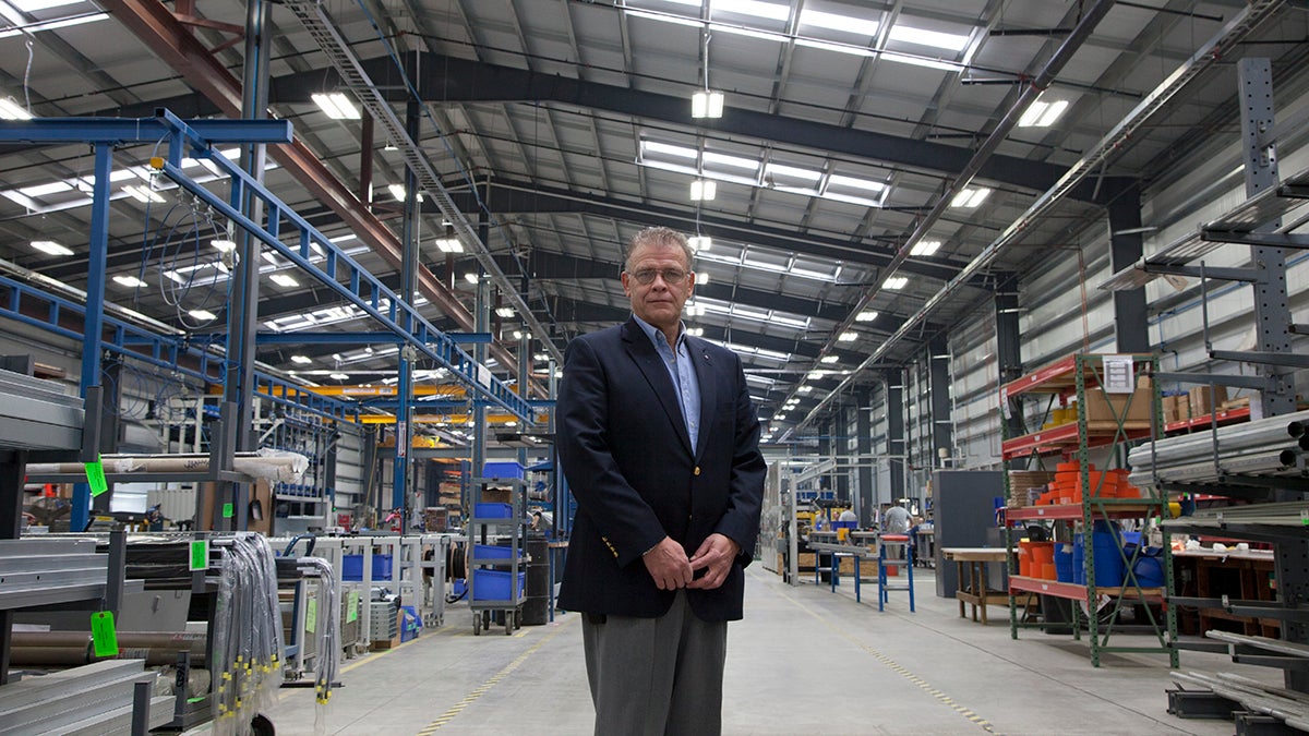  Mark Haley, President of Hormann Flexon, on the factory floor where workers produce high-speed doors. The company just moved to a new building, and Haley said finding a site that was already prepared and ready for vertical construction was essential. (Irina Zhorov/WESA) 